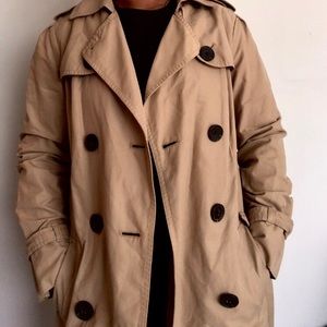 Tan/brown trench coat.